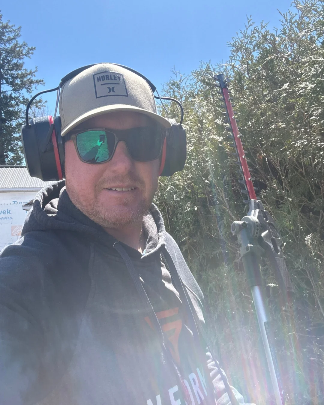 Professional Hedge Trimming Services by Yvan Audette in Ottawa Yvan Audette performing professional hedge trimming services in Ottawa, Ontario